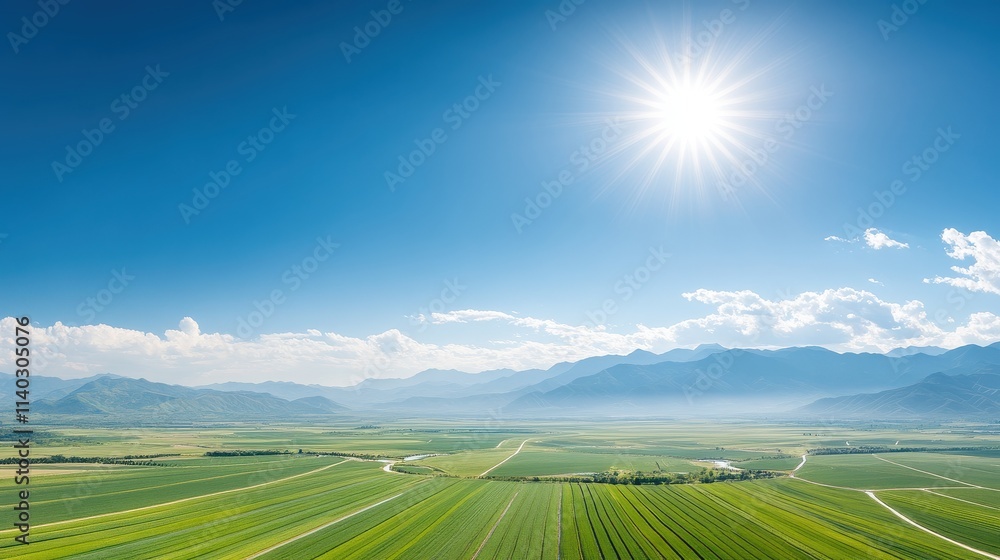 A vibrant landscape showcasing lush green fields under a bright blue sky with a radiant sun illuminating the scene.