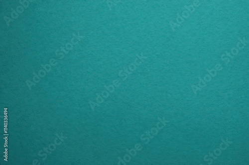 mediumturquoise color rough textured background with copy space, background for wallpaper, minimal flat lay.