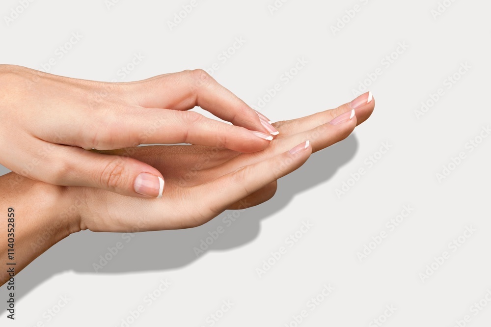 A pair of beautiful female hands on background A pair of beautiful female hands on background