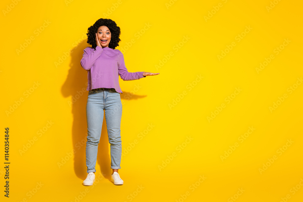 Full size photo of nice young woman measure empty space isolated on yellow color background Full size photo of nice young woman measure empty space isolated on yellow color background