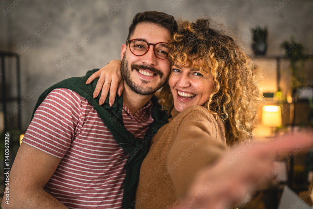Self portrait of couple girlfriend and boyfriend in love hug at home Self portrait of couple girlfriend and boyfriend in love hug at home