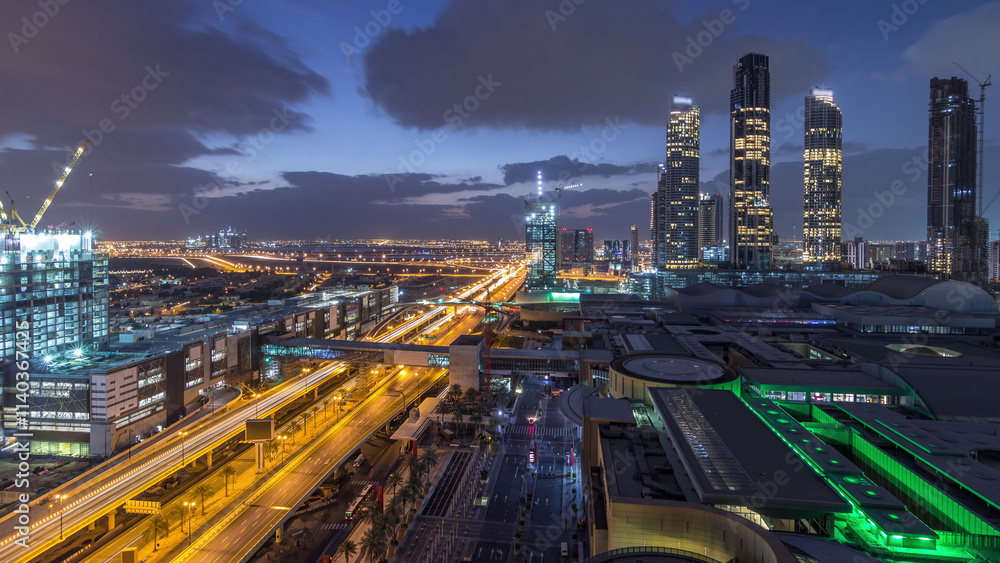 Obraz premium Aerial view of Financial center road night to day timelapse with under construction building