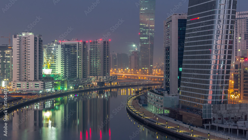 Naklejka premium The rhythm of the city of Dubai from night to morning aerial timelapse