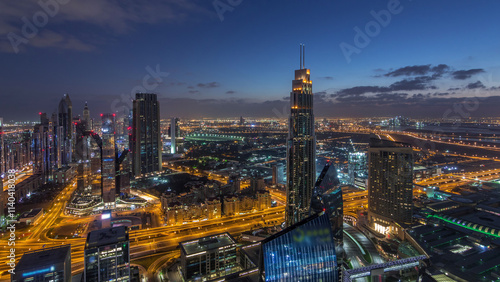 Wallpaper Mural Dubai International Financial Centre district with modern skyscrapers night to day timelapse Torontodigital.ca