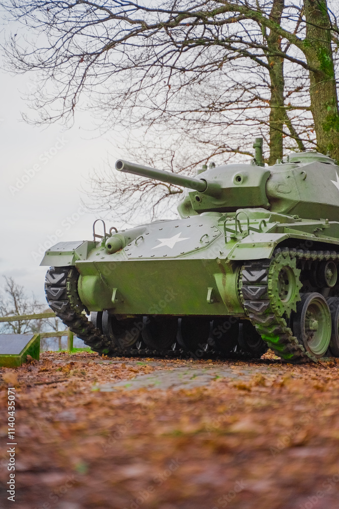 Fototapeta premium Historic Military Tank in a Scenic Forest Park Setting Highlighting War History and Vehicle Engineering