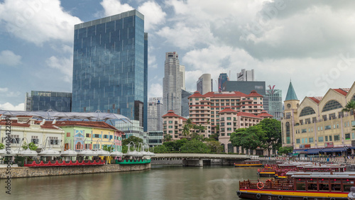 Tourist boats docking at Clarke Quay habour timelapse hyperlapse. photo