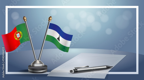 Portugal and Lesotho National flags on small table with bokeh background, cooperative relationship