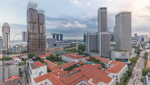 Evening panorama with Marina Bay area and skyscrapers city skyline aerial timelapse. photo