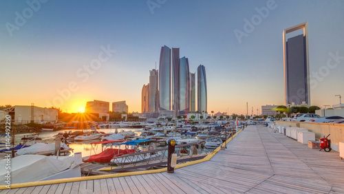 Al Bateen marina Abu Dhabi timelapse with modern skyscrapers on background photo