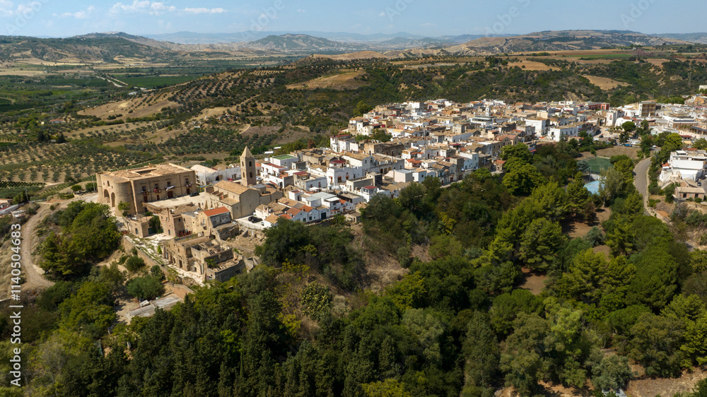 Panoramic aerial view of the historic center of the town of Bernalda, in the province of Matera, Basilicata, Italy. It is a traditional Italian village. Panoramic aerial view of the historic center of the town of Bernalda, in the province of Matera, Basilicata, Italy. It is a traditional Italian village.