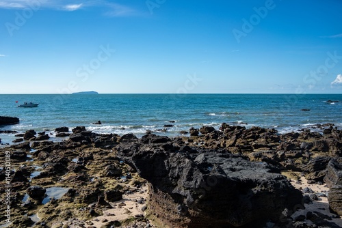 Exploring Crocodile Mountain at Weizhou Island in Beihai, Guangxi on a clear sunny day