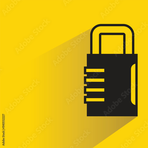 padlock key with shadow on yellow background