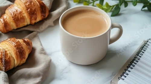 Relaxing morning with coffee and croissants on a cozy table setting