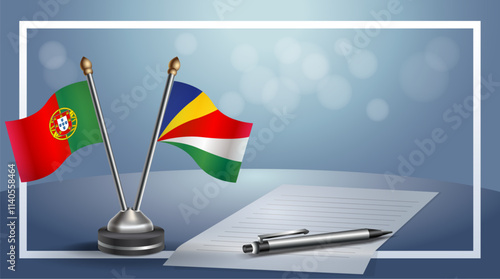 Portugal and Tajikistan National flags on small table with bokeh background, cooperative relationship