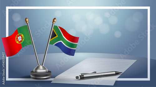 Portugal and South Africa National flags on small table with bokeh background, cooperative relationship