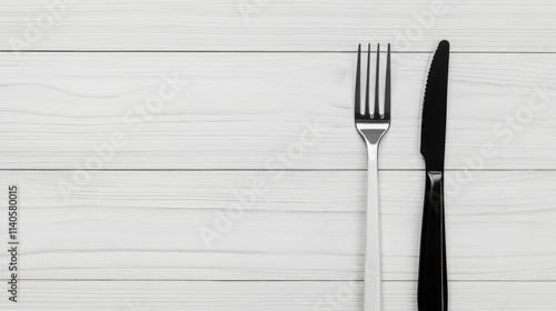 Black and White Fork with Knife on Light Wood Background, Flat Lay Minimalistic Dining or Cooking Concept, Ample Space for Text, High-Quality Professional Photo
