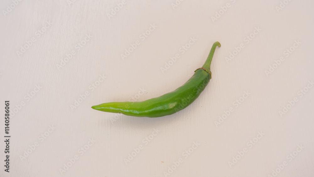 Fresh green chili pepper isolated on a white background Fresh green chili pepper isolated on a white background