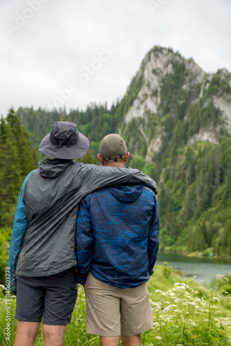 Wallpaper Mural Couple enjoying serene mountain view at Lac de Taney, Switzerland Torontodigital.ca