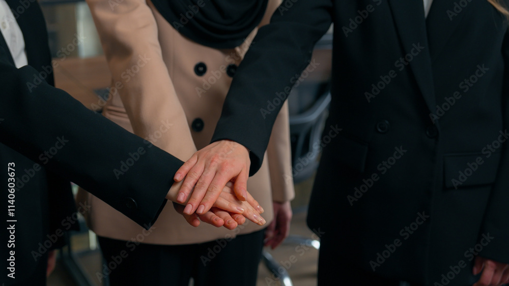 Obraz premium Multiracial women business colleagues three multiethnic businesswomen girls Caucasian Asian Muslim ladies ethnic different unite happy office team stack female hands together partnership collaboration