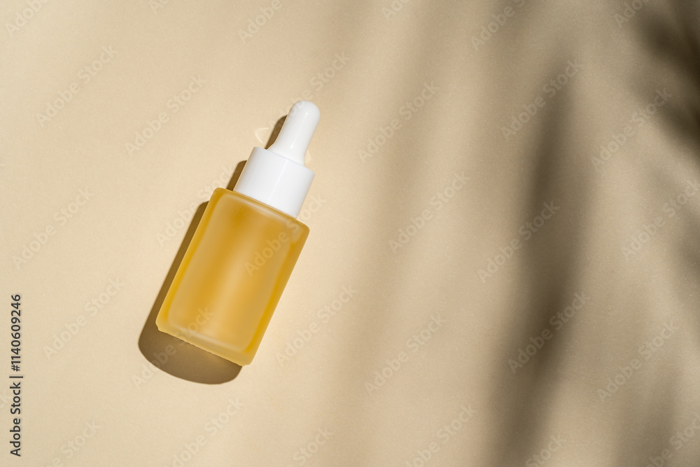 Serene cosmetic scene with dropper bottle on beige Serene cosmetic scene with dropper bottle on beige