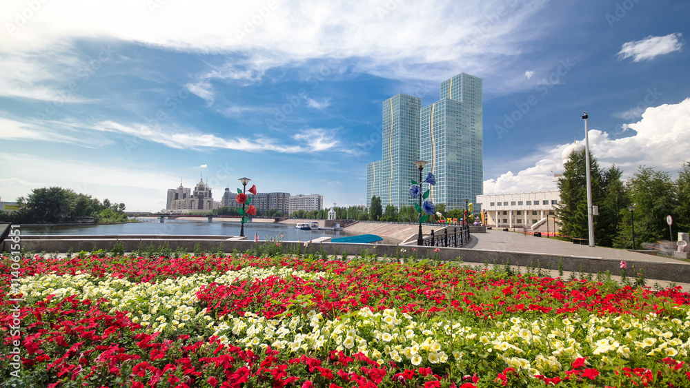 Flowerbed with red and yellow flowers on embankment timelapse hyperlapse. Astana, Kazakhstan Flowerbed with red and yellow flowers on embankment timelapse hyperlapse. Astana, Kazakhstan