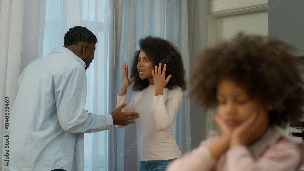African American family problem quarrel conflict arguing parents angry man father male husband argue yelling screaming mad woman female mother domestic violence upset little child kid girl daughter