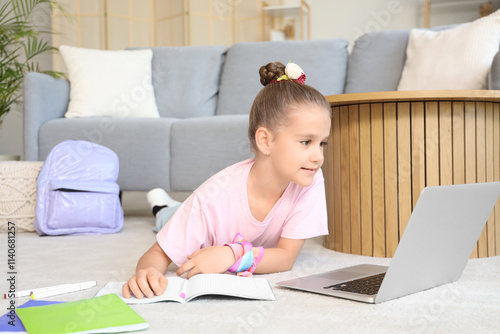 Little girl studying with l...