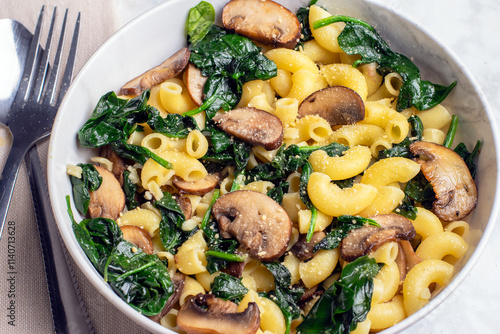 macaroni with  spinach,  and mushrooms photo