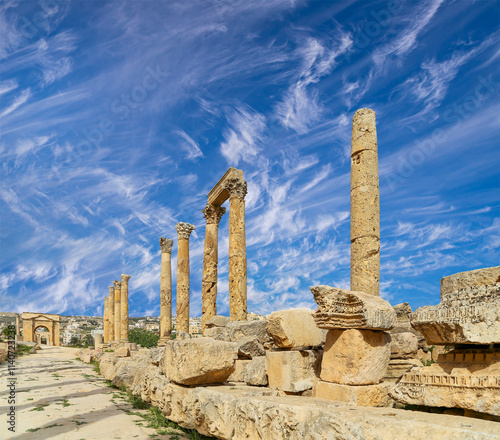 Roman ruins (against the background of a beautiful sky with clouds) in the Jordanian city of Jerash (Gerasa of Antiquity), capital and largest city of Jerash Governorate, Jordan #1140723238