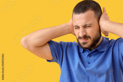 Young man suffering from ea...