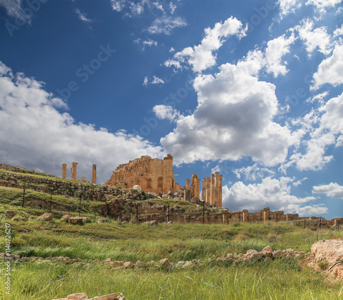 Roman ruins (against the background of a beautiful sky with clouds) in the Jordanian city of Jerash (Gerasa of Antiquity), capital and largest city of Jerash Governorate, Jordan #1140726217