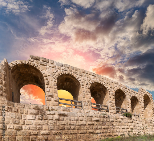 Roman ruins (against the background of a beautiful sky with clouds) in the Jordanian city of Jerash (Gerasa of Antiquity), capital and largest city of Jerash Governorate, Jordan #1140726285