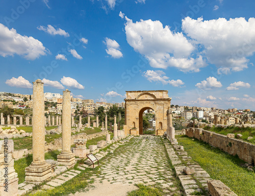 Roman ruins (against the background of a beautiful sky with clouds) in the Jordanian city of Jerash (Gerasa of Antiquity), capital and largest city of Jerash Governorate, Jordan #1140729403