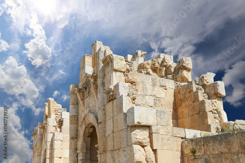 Roman ruins (against the background of a beautiful sky with clouds) in the Jordanian city of Jerash (Gerasa of Antiquity), capital and largest city of Jerash Governorate, Jordan #1140729830