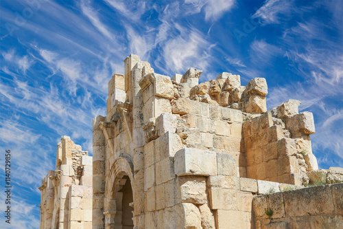 Roman ruins (against the background of a beautiful sky with clouds) in the Jordanian city of Jerash (Gerasa of Antiquity), capital and largest city of Jerash Governorate, Jordan #1140729856