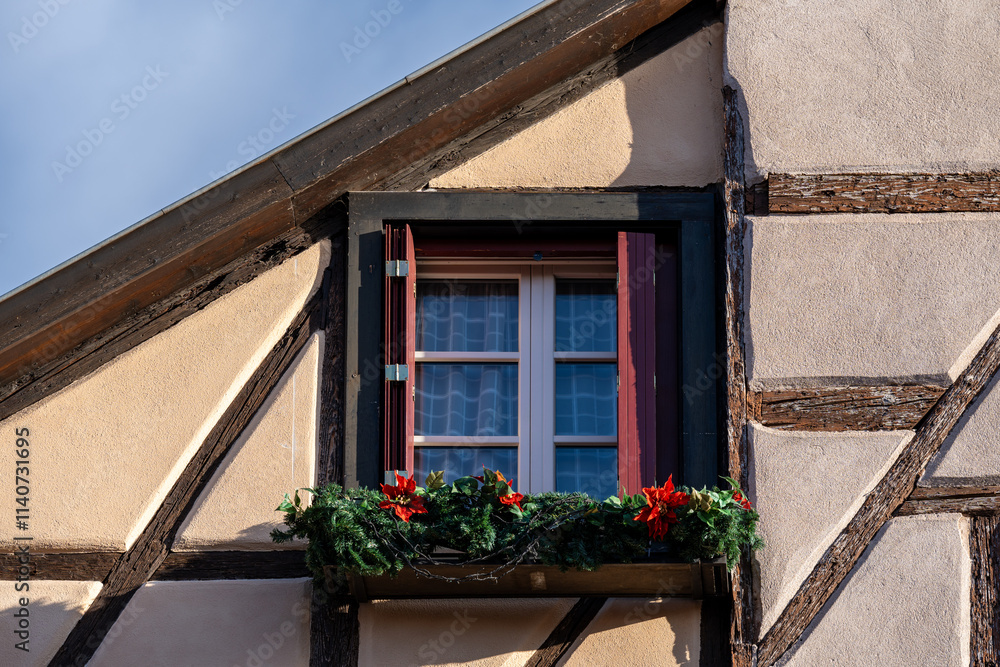 Close up of a window with Christmas Decorations of a half timbered houses Colmar France Close up of a window with Christmas Decorations of a half timbered houses Colmar France