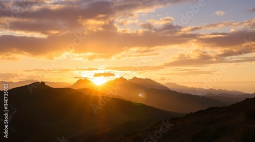 Wallpaper Mural  beautiful sunset over mountainous terrain. The sun is setting on the horizon, casting warm light across the landscape and creating a dramatic sky with hues of orange and purple. Torontodigital.ca