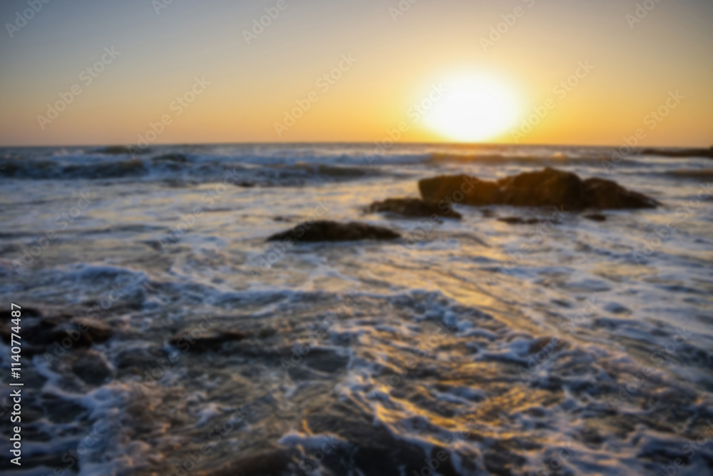 Blurred ocean waves at sunset Blurred ocean waves at sunset