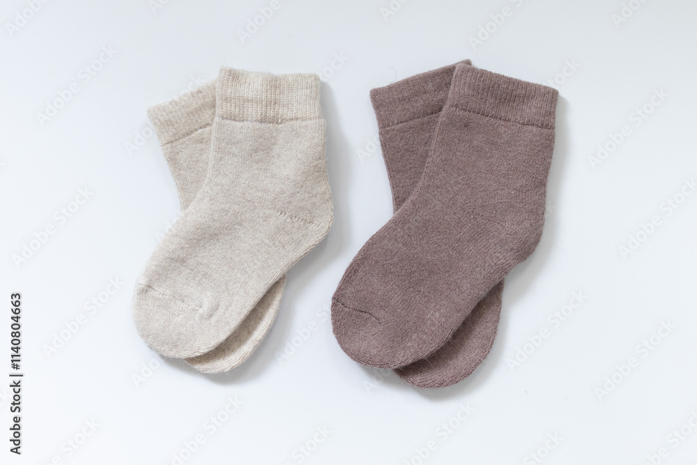 two Pair of striped woolen knitted socks isolated on white two Pair of striped woolen knitted socks isolated on white