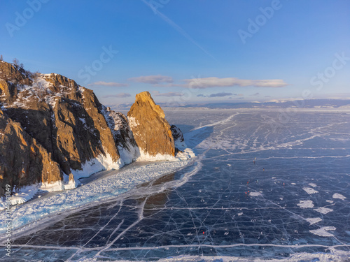 A white van is driving on a snowy road
