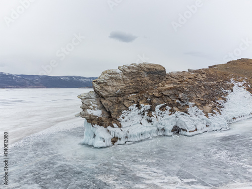 A white van is driving on a snowy road
