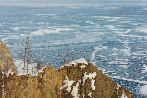 A white van is driving on a snowy road