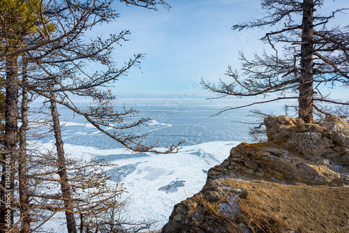 A white van is driving on a snowy road