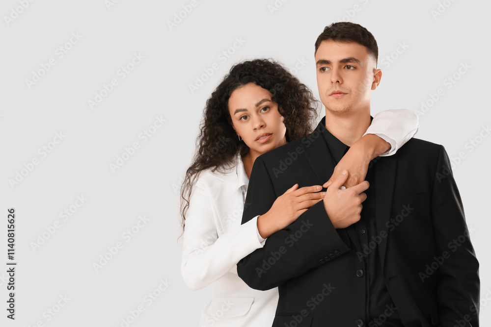 Young couple hugging on white background. Yin Yang concept Young couple hugging on white background. Yin Yang concept