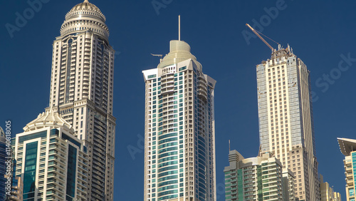 Dubai Marina with tallest skyscrapers and boats timelapse hyperlapse