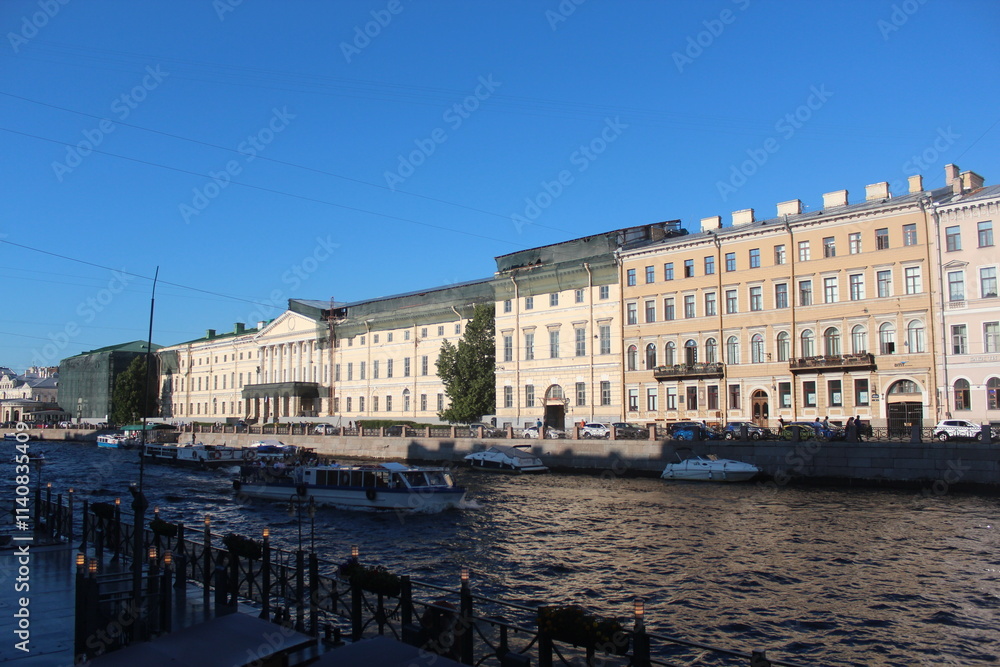 Obraz premium Singer Building, Hermitage Museum Building, Winter Palace, Alexander Column, Palace Square in St. Petersburg, Nevski Prospect, Neva River and tour boats, Peter Pavel Fortress. St.Petersburg Russia