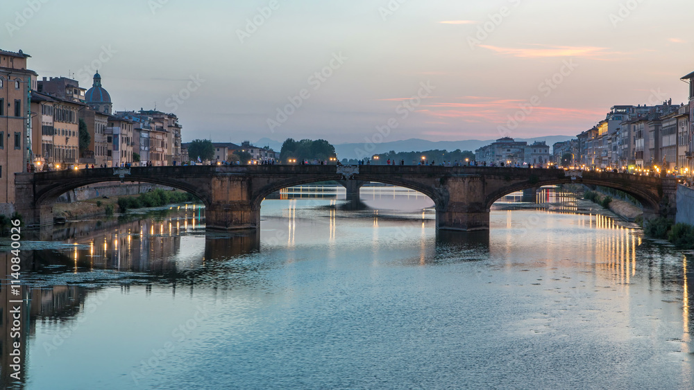 Obraz premium Ponte Santa Trinita Holy Trinity Bridge day to night timelapse over River Arno in Florence