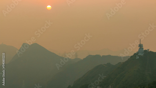 Cityscape of Hong Kong as viewed atop Kowloon Peak with sunset timelapse with Hong kong and Kowloon below photo