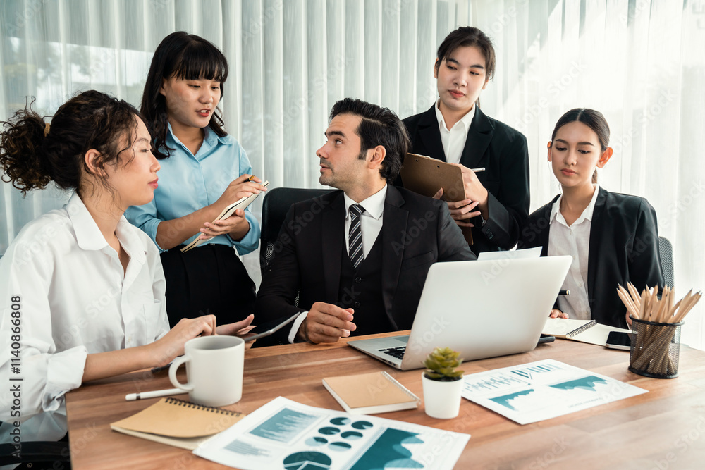 Diverse group of business analyst team analyzing financial data report paper on office table. Chart and graph dashboard by business intelligence analysis for strategic marketing planning Habiliment Diverse group of business analyst team analyzing financial data report paper on office table. Chart and graph dashboard by business intelligence analysis for strategic marketing planning Habiliment