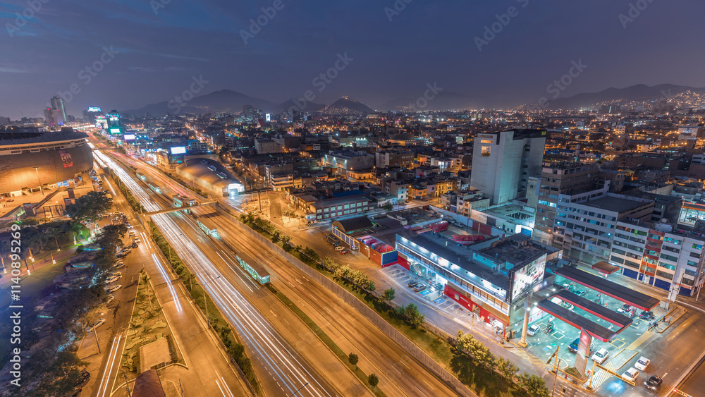 Aerial view of Via Expresa highway and metropolitan bus with traffic day to night timelapse. Lima, Peru Aerial view of Via Expresa highway and metropolitan bus with traffic day to night timelapse. Lima, Peru